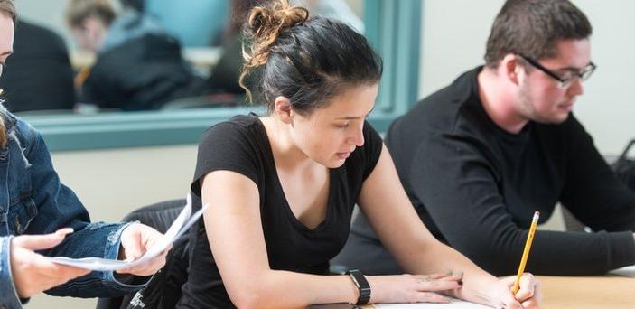 Students taking notes in class